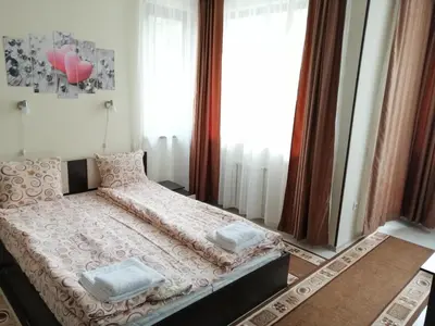 a bedroom with a bed with pillows on it at Studio in Borovets Gardens Complex in Borovets
