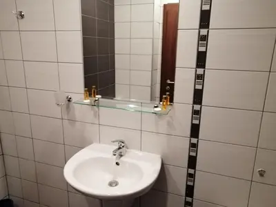 a bathroom with a sink and a mirror at Studio in Borovets Gardens Complex in Borovets