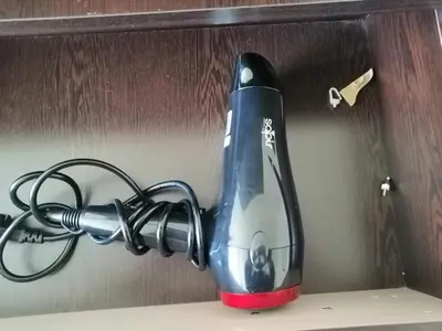 a hair dryer sitting on top of a shelf at Studio in Borovets Gardens Complex in Borovets