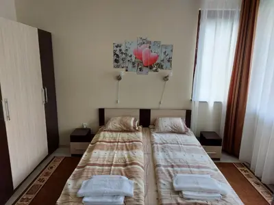 two beds in a bedroom with towels on them at Studio in Borovets Gardens Complex in Borovets