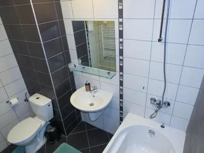 a bathroom with a white toilet and a sink at Rivendell Apartments Borovets Gardens complex in Borovets