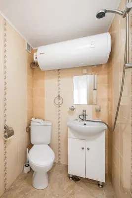 a bathroom with a toilet and a sink at Apartments Ivadoni in Velingrad