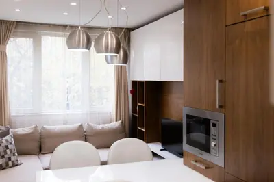 a living room with a couch and a television at Lozenets Apartment in Sofia