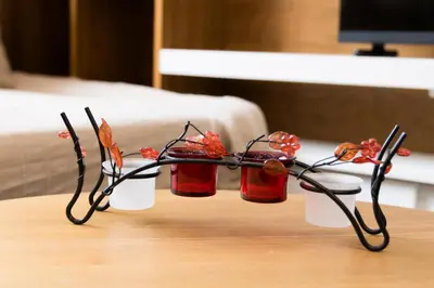 a pair of glasses sitting on top of a table at Lozenets Apartment in Sofia