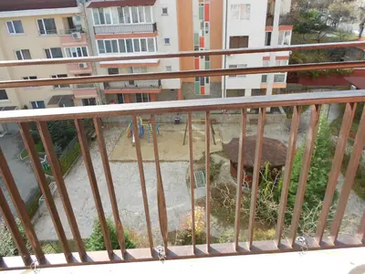 a balcony of a building with a view of a fountain at Апартамент Мур in Sofia