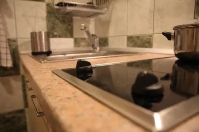 a kitchen with a sink and a counter top at Apartment 132 in Sofia