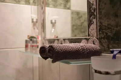 a towel sitting on a glass shelf in a bathroom at Apartment 132 in Sofia