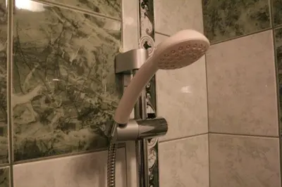 a blow dryer in a shower in a bathroom at Apartment 132 in Sofia