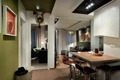 a kitchen and living room with a table and chairs at Iceberg Apartment 50 in Borovets