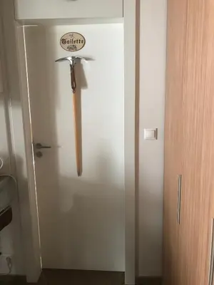 a door with a baseball bat on the wall at Iceberg Apartment 50 in Borovets