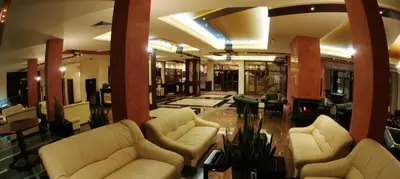 a lobby with white couches and tables in a building at Iceberg Apartment 50 in Borovets