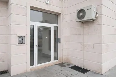 a building with a window and a fan at Sofia Top Apartments in Sofia
