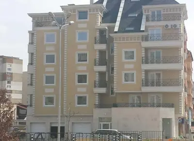 a tall building with a street light in front of it at Sofia Top Lux Apartment in Sofia