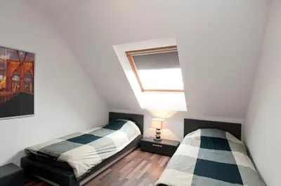 a bedroom with two beds and a window at Sofia Top Lux Apartment in Sofia