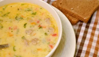 a bowl of soup and a plate of toast at Snow Heaven Hotel in Bankya