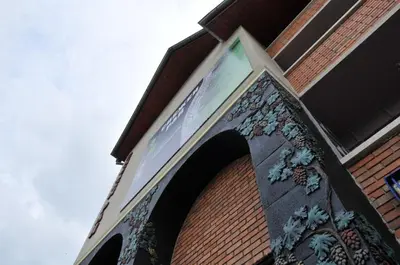 a building with a sign on the side of it at Snow Heaven Hotel in Bankya