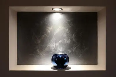 a blue vase sitting in front of a wall at Silver Springs in Sofia