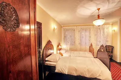 a bedroom with a bed and a window at Hotel Evmolpia in Plovdiv