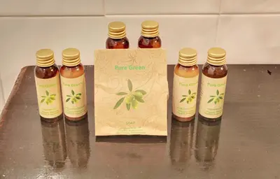 a group of four bottles of honey sitting on a counter at Hotel Evmolpia in Plovdiv