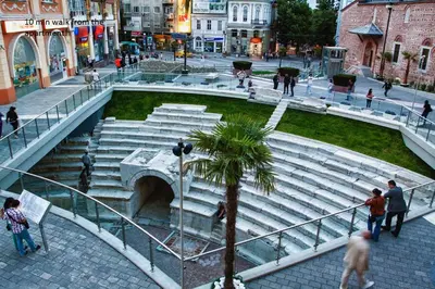 a group of people walking around a group of stairs at City Garden Studio in Plovdiv