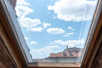 a window with a view of the sky at Rentapart Step in Sofia
