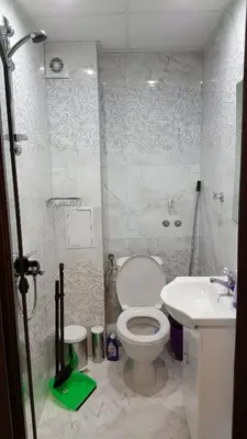 a bathroom with a toilet and a sink at Ayberk Apart Sandanski in Sandanski