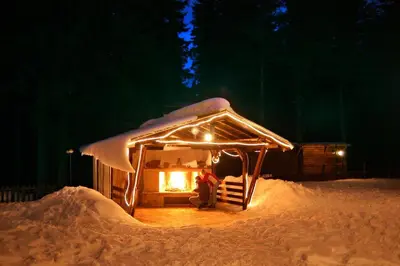 a person sitting in a gazebo in the snow at Manastira 2 apt Emo Pamporovo in Pamporovo