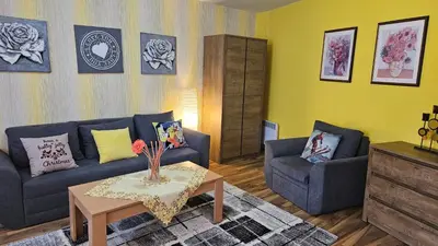 a living room with a couch and two chairs and a table at Ramada 2 Boutique Apartment near Ski Road in Bansko