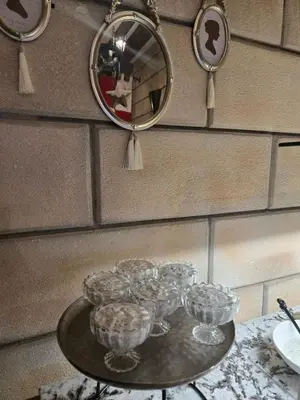 a table with glasses on it in front of a mirror at Royal Valentina Castle in Ognyanovo