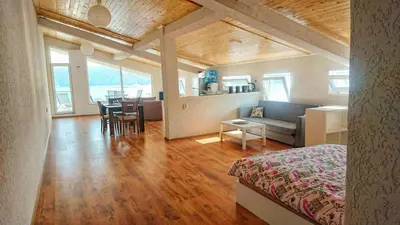 a room with a bed and a couch and a table at Lakeview-Estate ApartHotel in Staro Myasto
