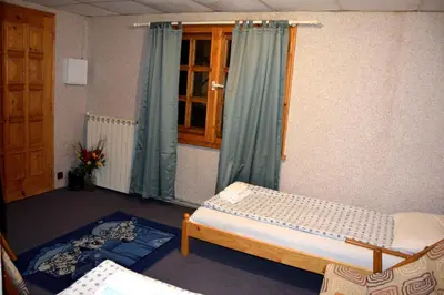 a small room with two beds and a window at Persey Villa Borovets in Borovets