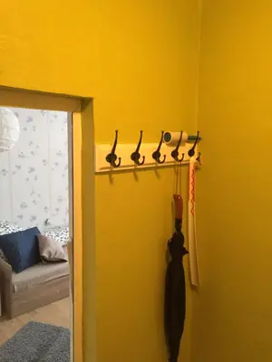 a group of pairs of scissors hanging on a wall at Airport Apartment in Sofia