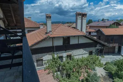 an aerial view of a house with two towers at Kadiyata Guest House in Bansko