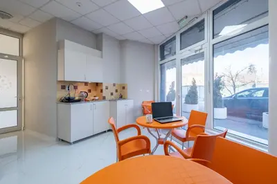 a kitchen with a table with a laptop on it at Blue Label Apart House in Sofia