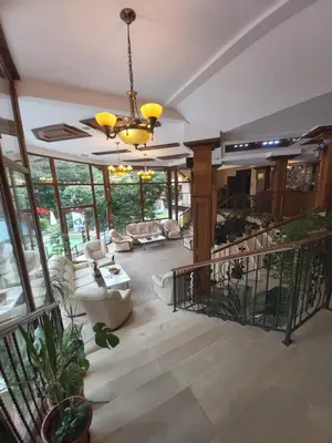 a large living room with a chandelier at Galaxy Hotel in Chiflik