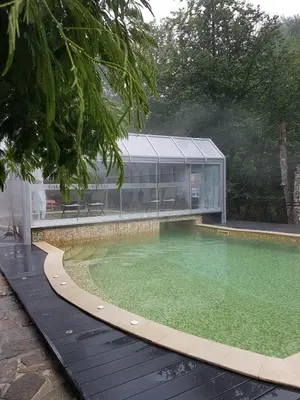 a large pool of water in front of a building at Galaxy Hotel in Chiflik