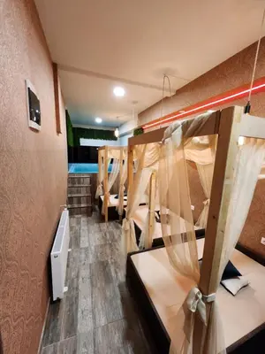 a room with several bunk beds in it at Hotel Central Point in Sofia