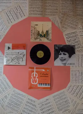 a cd and other items on a table at Serdika Rooms in Sofia