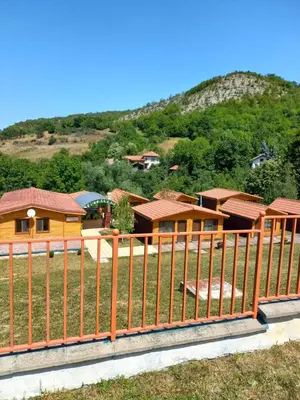 a fence in front of a group of houses at Вилно селище МИРОВЕЦ in Malŭk Izvor