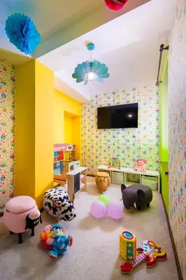 a childs play room with toys and a tv at Hotel Alfaresort Thermal Chiflika in Chiflik