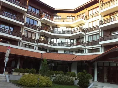 an apartment building with balconies and a courtyard at Oksana's Apartment at Infinity in Bansko