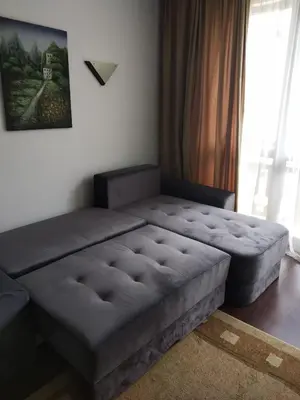a large bed in a room with a window at Oksana's Apartment at Infinity in Bansko