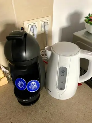 a coffee maker and a coffee pot on a counter at Golden Dome view Apartment in Sofia