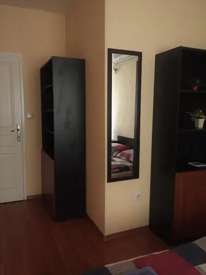 a room with a mirror and a black cabinet at Pirotska Apartment GN / FREE GARAGE in Sofia