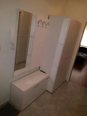a white bathroom with a sink and a mirror at Pirotska Apartment GN / FREE GARAGE in Sofia