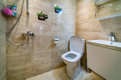a bathroom with a toilet and a shower and a sink at Spacious 2-Bedroom Apartment - Ideal for Families & Groups - City Center in Sofia