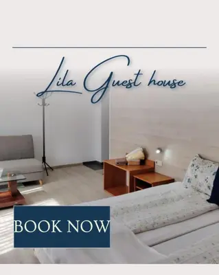a living room with a couch and a table at Guest House Lila in Bansko