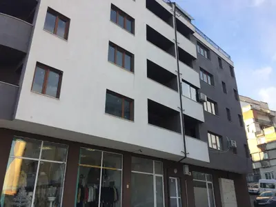 a tall building with windows on the side of it at Apartment Spa Holidays in Sandanski
