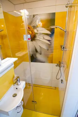 a bathroom with a shower and a toilet and a sink at Sunshine Sofia in Sofia