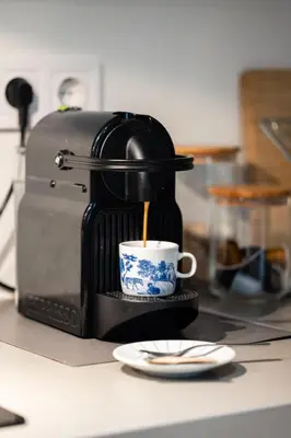 a coffee maker sitting on a counter with a cup of coffee at Casa Dolce Far Niente, 2BATH&2BED, PARKING, Vitosha blvd in Sofia